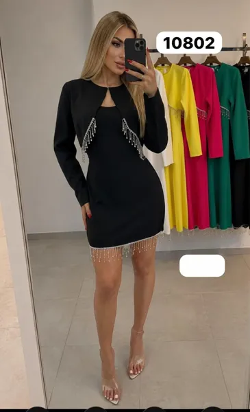 Vestido corto con torera y flecos