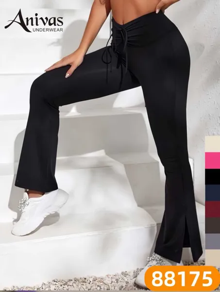 Pantalones deportivos acampanados de cintura alta con abertura