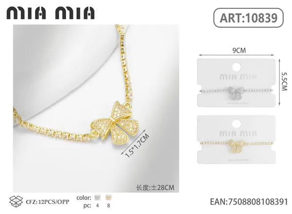 Pulsera dorada con moño de circonias