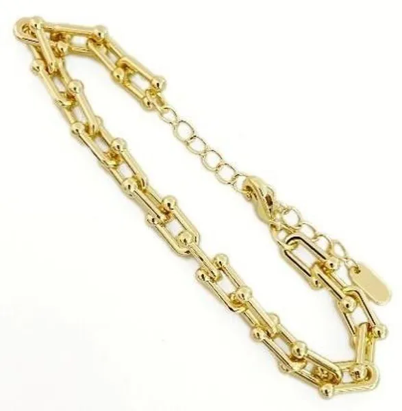 Pulsera dorada de eslabones tipo herradura