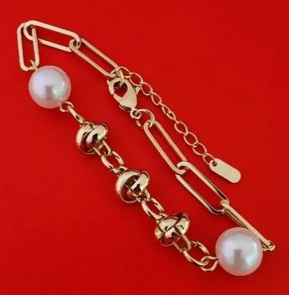 Pulsera dorada con perlas y eslabones