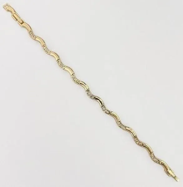 Pulsera dorada ondulada con circonias