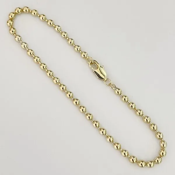Pulsera de bolitas doradas
