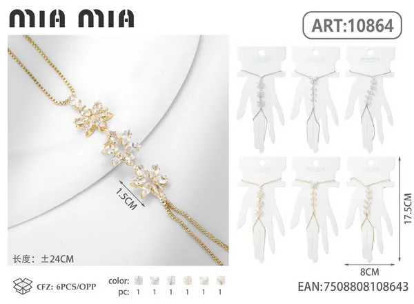 Pulsera de mano dorada con circonias