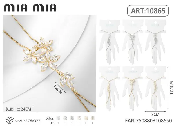 Pulsera de mano dorada con flores de circonias