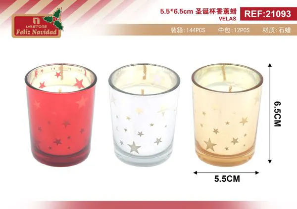 Vela aromática navideña en vaso con estrellas
