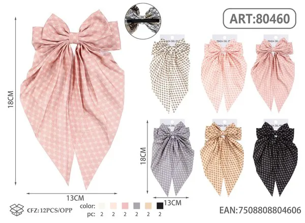 Broche para cabello de moño con colas largas y estampado de puntos rosa