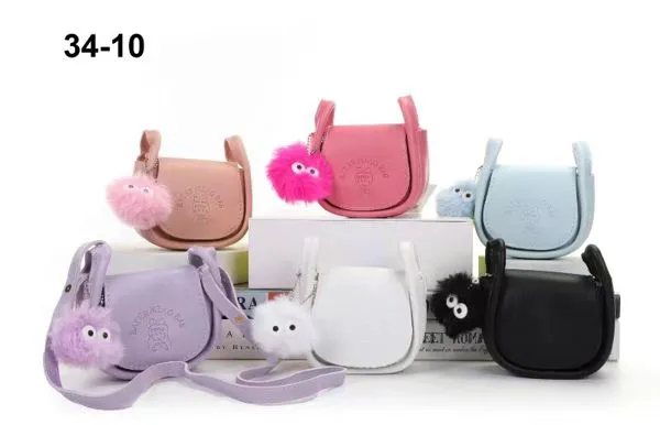 Bolsa cruzada con pompón para niña