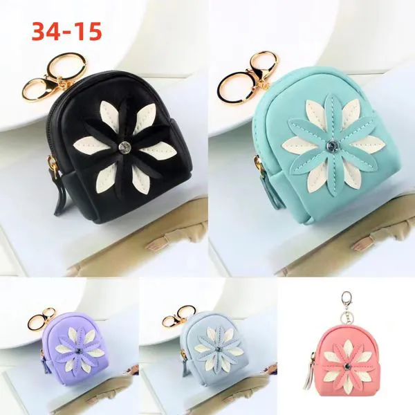 Monedero mini mochila con flor