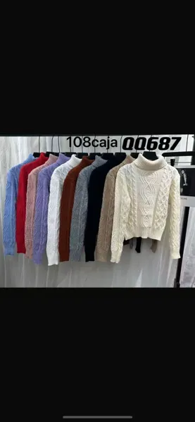 Suéter holgado de punto trenzado con cuello alto